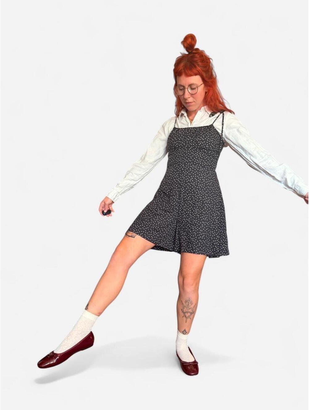 Black & white polka dot romper with tie straps, which makes them adjustable!